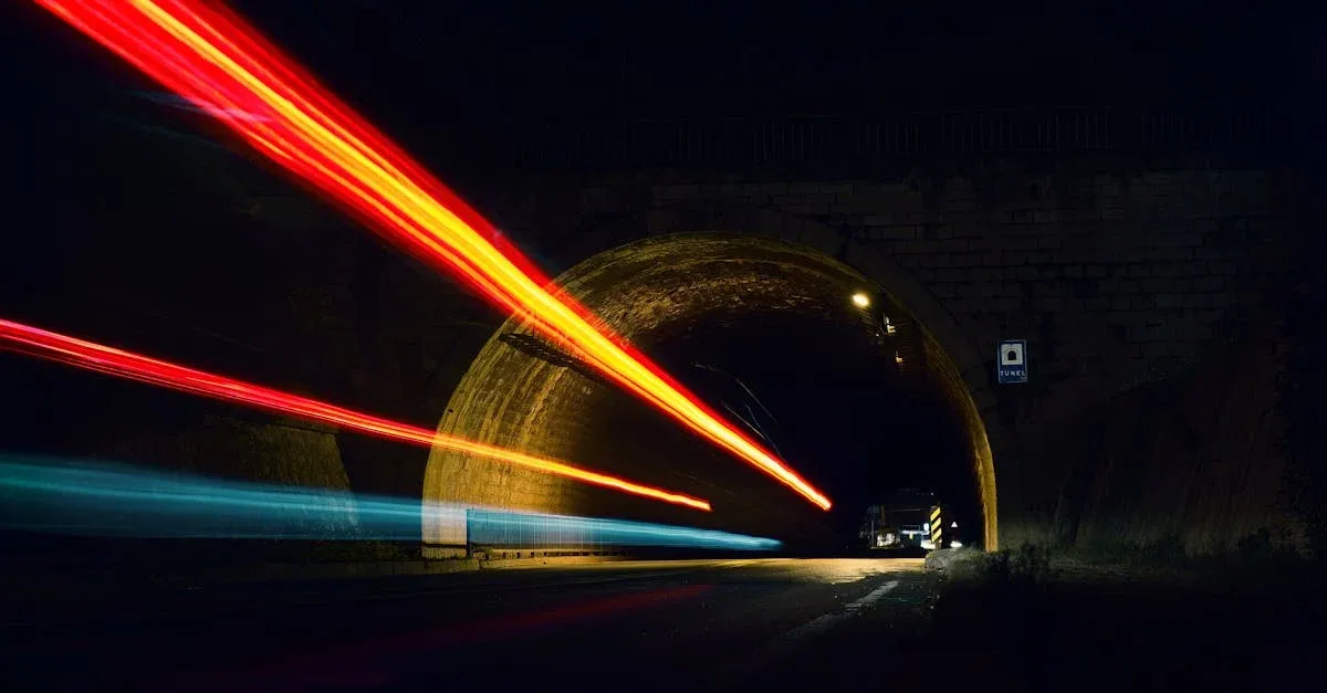 image of a tunnel with the lights from cars